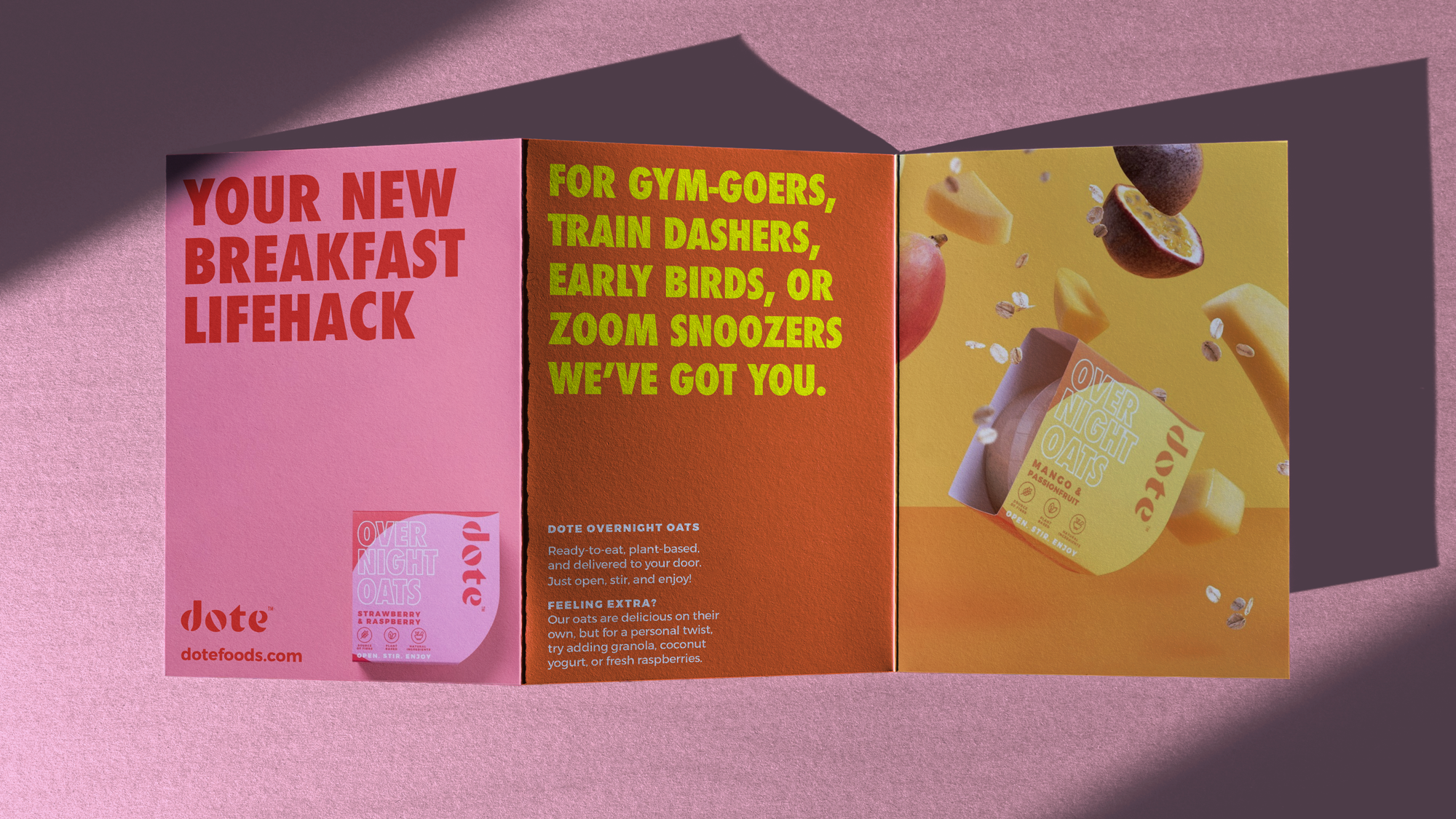 Dote gatefold leaflet opened out — 'Your new breakfast lifehack' in red on pink, 'For gym-goers, train dashers, early birds, or zoom snoozers we've got you.' in yellow on orange, and a mango and passionfruit pot with falling fruit.