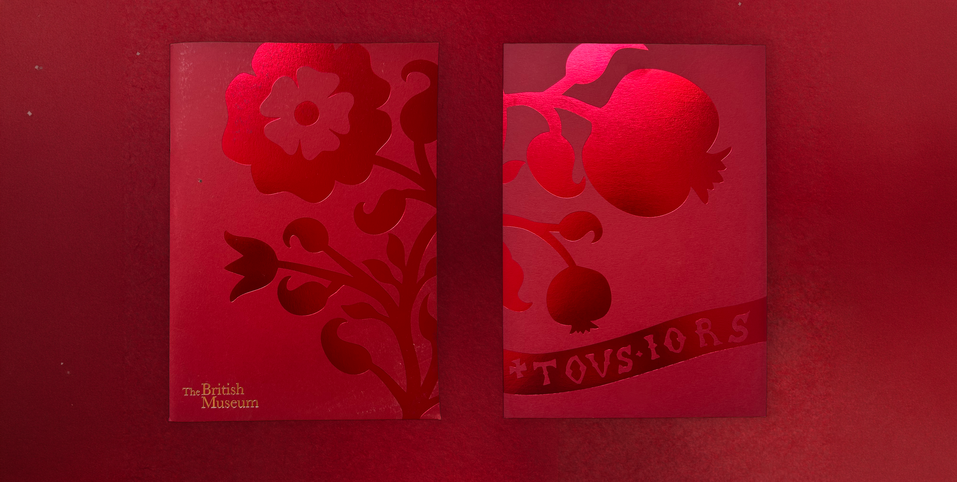 Two deep red foiled covers for the British Museum Trustees' Dinner — a Tudor rose and a pomegranate with the motto 'tousiors'.
